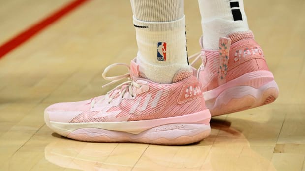 View of Damian Lillard's pink adidas shoes.